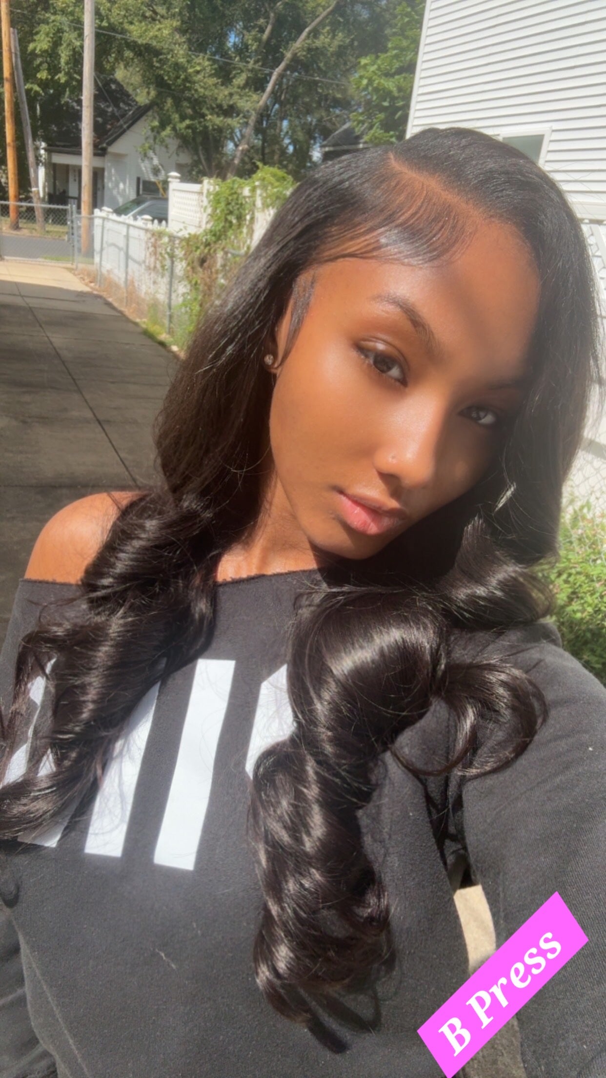 Customer wearing 3 bundles of Body Wave virgin human hair styled in loose, flowing waves – B Press Bundles